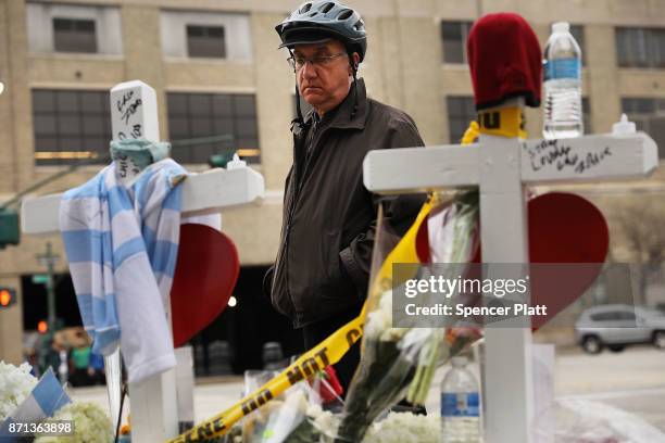 Mark Hennen looks at the eight crosses marking the location where terrorist Sayfullo Saipov entered a Manhattan bike path and went on a rampage with...