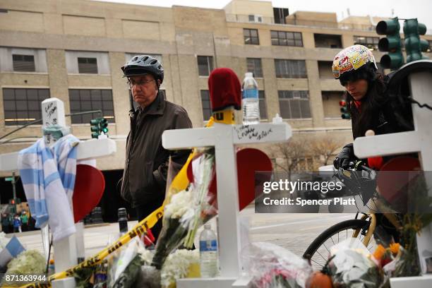 Mark Hennen looks at the eight crosses marking the location where terrorist Sayfullo Saipov entered a Manhattan bike path and went on a rampage with...