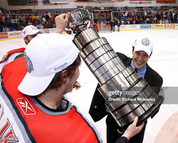 Dmitry Kulikov presents the Presidents Cup to Drummondville Voltigeurs head coach Guy Boucher after defeating the Shawinigan Cataractes 3-2 in Game 7...