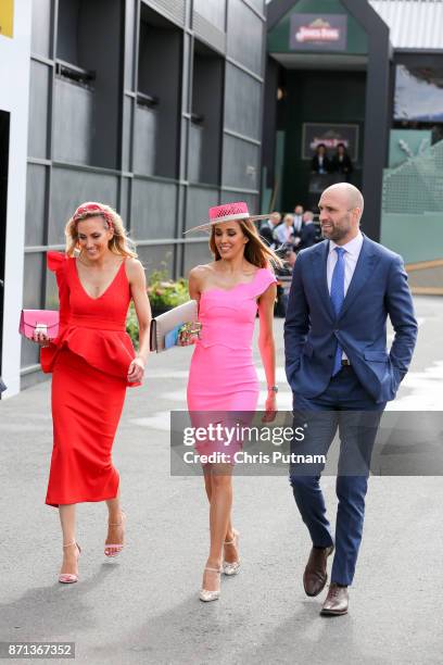 Sisters Kate Twigley, Rebecca Judd and Chris Judd arrive at the Melbourne Cup CarnivalPHOTOGRAPH BY Chris Putnam /