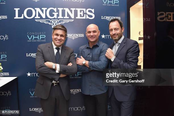 Vice President of Longines and head of International Marketing, Juan-Carlos Capelli, Andre Agassi and President of Longines United States, Pascal...