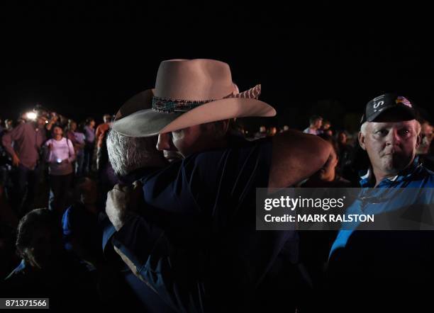 Stephen Willeford and Johnnie Langendorff, who both chased after suspected killer Devin Kelley, hug during a vigil in Sutherland Springs, Texas on...