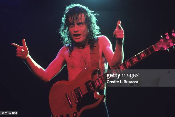 Australian musician Angus Young, of the group AC/DC, performs at the Nassau Coliseum, Uniondale, New York, September 20, 1986.