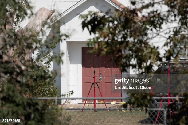 Bullet holes scar the front door of the First Baptist Church of Sutherland Springs on November 7, 2017 in Sutherland Springs, Texas. On November 5, a...