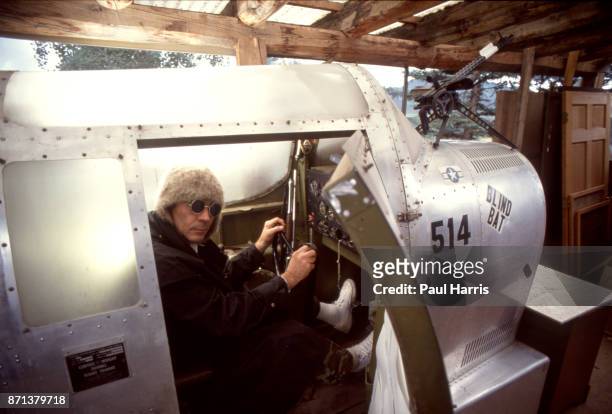 Hunter Thompson aka Hunter S Thompson aka Gonzo Journalist at his ranch sitting in his Link Trainer with a pistol on October 12, 1990 in Woody Creek,...