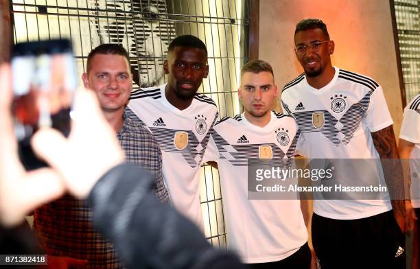 German National Football Team Players Antonio Ruediger and Jerome Boateng pose with fans at the presentation of the 2018 FIFA World Cup Russia Adidas...