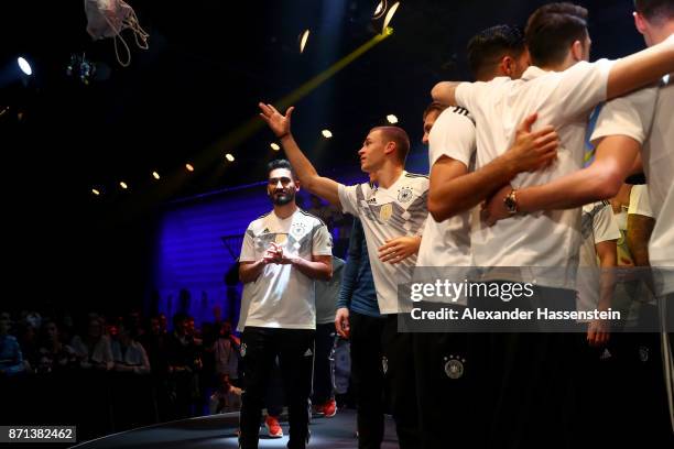 German National Football Team Player Joshua Kimmich throws out a goodie bag to fans during the presentation of the 2018 FIFA World Cup Russia Adidas...