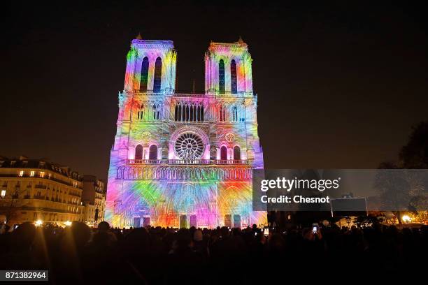 Sound and light show called "Dame de Coeur" is projected on the facade of the Notre-Dame cathedral on November 7, 2017 in Paris, France. On the...