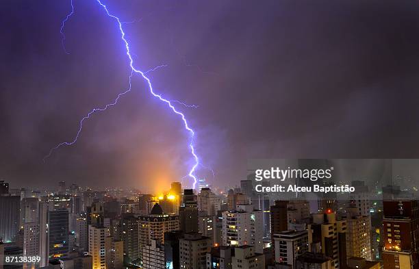 lightning bolt over urban skyline. - brazil skyline stock pictures, royalty-free photos & images