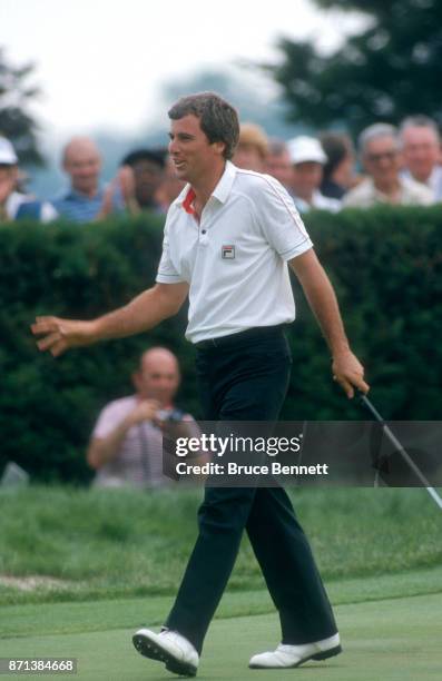 Curtis Strange of the United States waves to the crowd after making his putt during the Manufacturers Hanover Westchester Classic circa June, 1982 at...