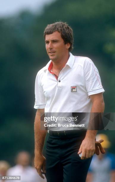 Curtis Strange of the United States walks on the green during the Manufacturers Hanover Westchester Classic circa June, 1982 at the Westchester...