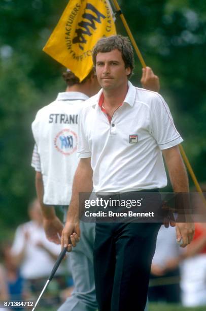 Curtis Strange of the United States walks on the green after making his putt during the Manufacturers Hanover Westchester Classic circa June, 1982 at...