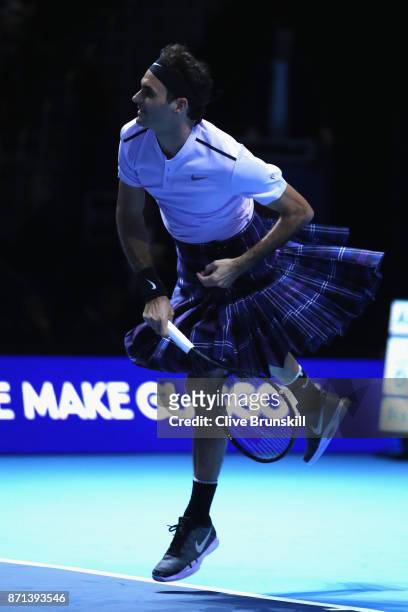 Roger Federer plays a shot whilst wearing a kilt during his match against Andy Murray during Andy Murray Live at The Hydro on November 7, 2017 in...