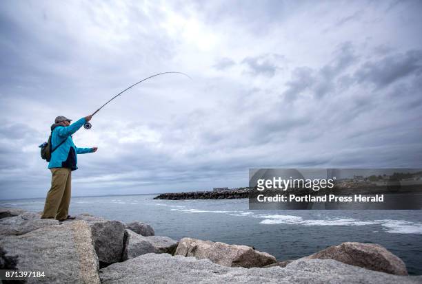 Jilles Dionne of Durham, N.H. Casts his flyline at the breakwater in Kennebunkport on Friday, June 16 hoping to land a striper.