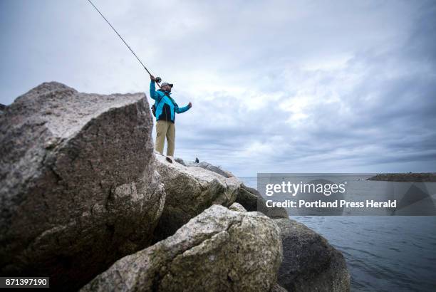 Jilles Dionne of Durham, N.H. Casts his flyline at the breakwater in Kennebunkport on Friday, June 16 hoping to land a striper.