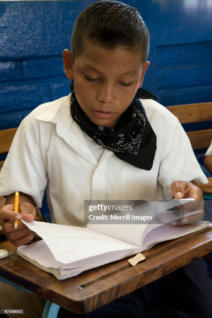 Boy in classroom doing school work