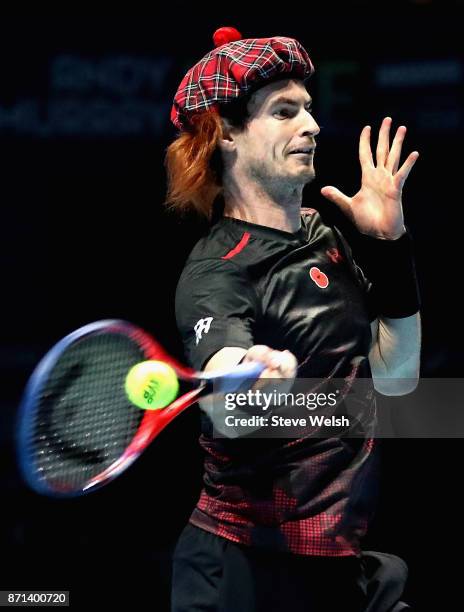 Andy Murray plays a shot during his match against Roger Federer during Andy Murray Live at The Hydro on November 7, 2017 in Glasgow, Scotland.