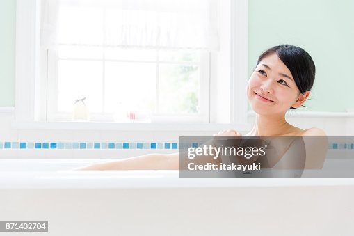 Young asian woman in bathroom Young asian woman in bathroom