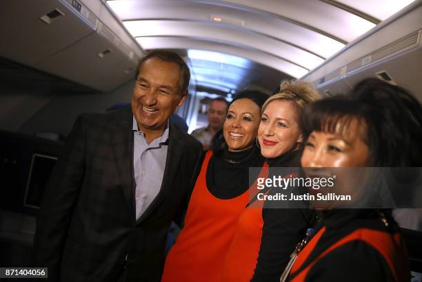 United Airlines CEO Oscar Munoz take a photo with flight attendants aboard United Airlines flight 747 before it takes off on its final flight from...