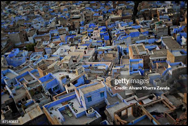 Dawn breaks in the 'blue city' of Jodhpur, while religious chants sound out along with temple bells. Families awaken after sleeping on the flat...