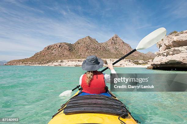 woman paddling sea kayak - northern mexico stock pictures, royalty-free photos & images