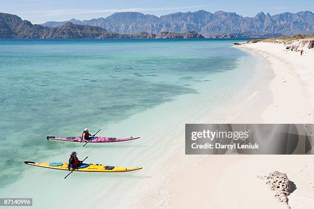 kayaks and lagoon - northern mexico stock pictures, royalty-free photos & images