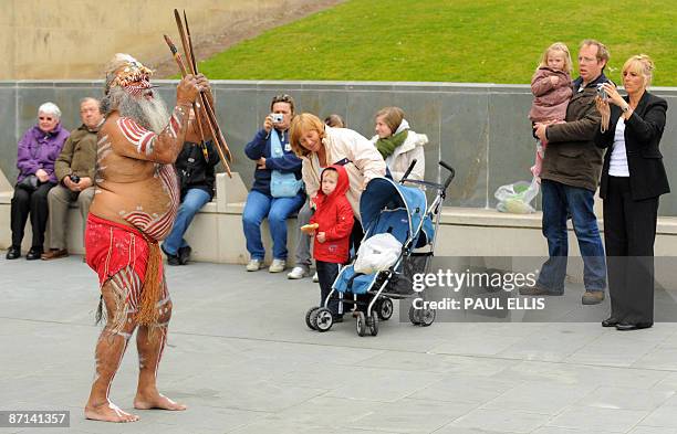Major Sumner , an elder from Australia's Ngarrindjeri indigenous people, performs a traditional "smoking ceremony" using smouldering eucalyptus...