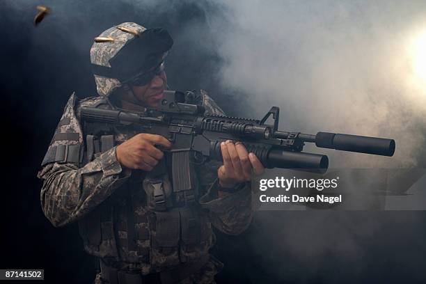 soldier firing an automatic rifle - special forces stock pictures, royalty-free photos & images