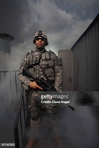 soldier on rooftop - army helmet stock pictures, royalty-free photos & images