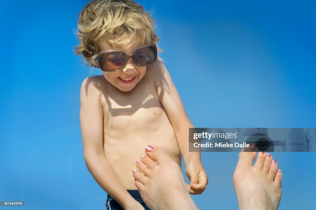 Child wearing to big sunglasses