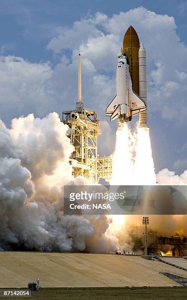 In this handout image provided by NASA, the Space Shuttle Atlantis STS-125 blasts off from launch pad 39-A at Kennedy Space Center on May 11, 2009 in...