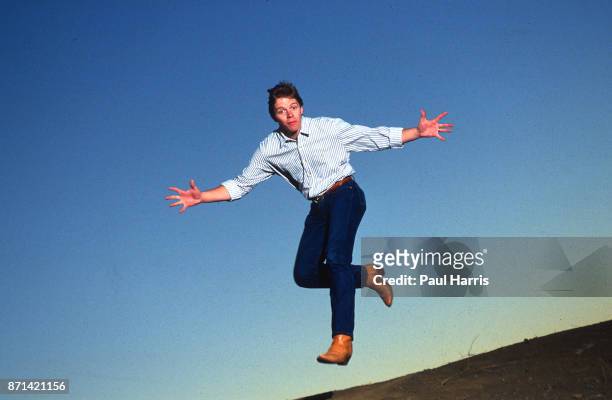 Actor Thomas F Wilson who played Biff Tannen in the 1985 film Back To The Future leaps in the air on February 24, 1990 in the Santa Monica Mountains,...
