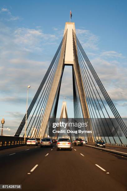 driving across glebe bridge - glebe island bridge stock pictures, royalty-free photos & images