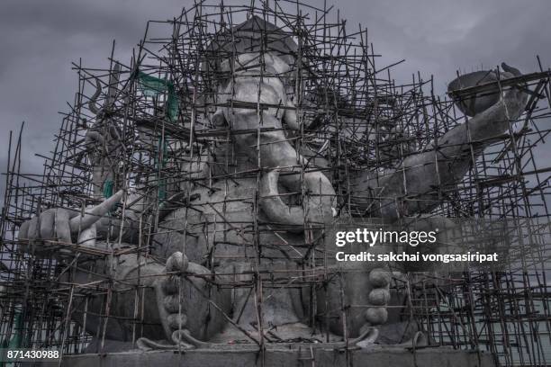 idyllic view of constructions the big statue of ganesha in nakhon nayok, thailand. - hindu segenszeichen stock-fotos und bilder