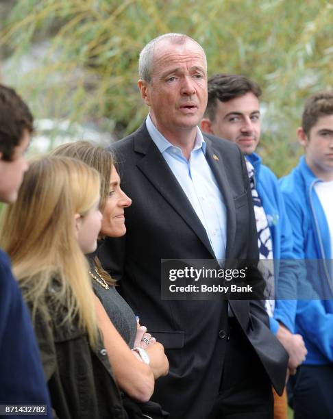 Democratic gubernatorial candidate Phil Murphy attends a news conference with his family after voting on election day November 7, 2017 in Asbury...