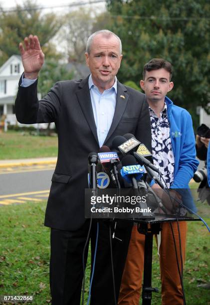 Democratic gubernatorial candidate Phil Murphy and son Josh attend a news conference after voting on election day November 7, 2017 in Asbury Park,...