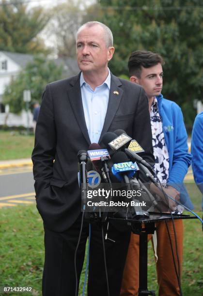 Democratic gubernatorial candidate Phil Murphy and son Josh attend a news conference after voting on election day November 7, 2017 in Asbury Park,...