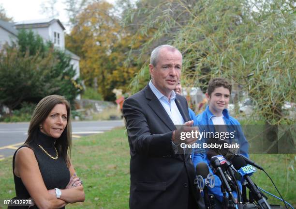 Democratic gubernatorial candidate Phil Murphy attends a news conference with wife Tammy Murphy and son Sam after voting on election day November 7,...