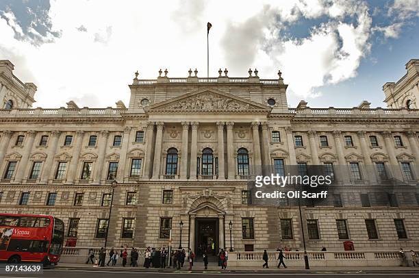 Members of the public walk past of the Government department of "HM Revenue and Customs" in Westminster on May 8, 2009 in London, England.