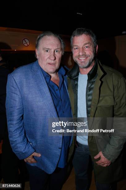 Gerard Depardieu and CEO of Courreges Jacques Bungert pose after "Depardieu Chante Barbara" at Le Cirque d'Hiver on November 6, 2017 in Paris, France.