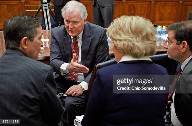 Edward Liddy introduces Rep. Dennis Kucinich and AIG Vice Chairman for Legal Affairs Anastasia Kelly during a break in testimony before the House...