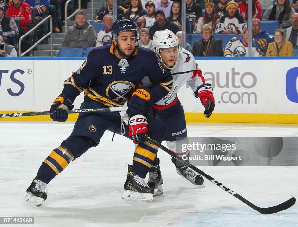 Nicholas Baptiste of the Buffalo Sabres battles for position with Aaron Ness of the Washington Capitals during an NHL game on November 7, 2017 at...