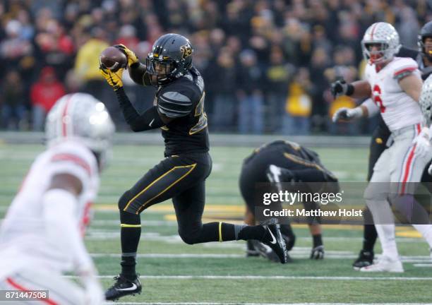 Running back Akrum Wadley of the Iowa Hawkeyes catches a pass during the third quarter against the Ohio State Buckeyes on November 04, 2017 at...