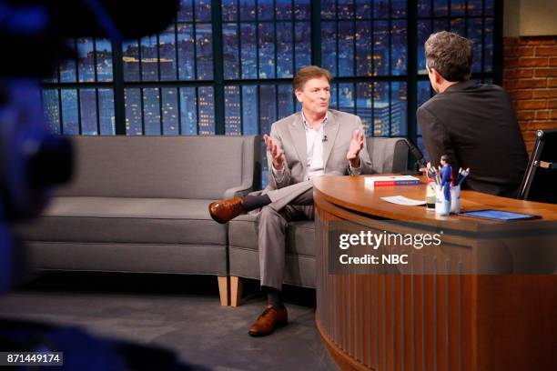 Episode 604 -- Pictured: Author Michael Lewis talks with host Seth Meyers during an interview on November 7, 2017 --