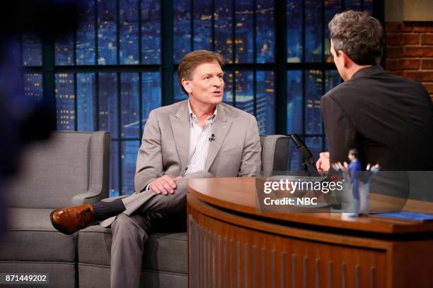 Episode 604 -- Pictured: Author Michael Lewis talks with host Seth Meyers during an interview on November 7, 2017 --