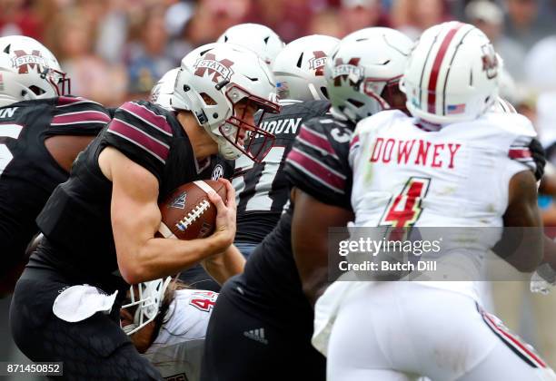 Nick Fitzgerald of the Mississippi State Bulldogs carries the ball during the second half of an NCAA football game against the Massachusetts...