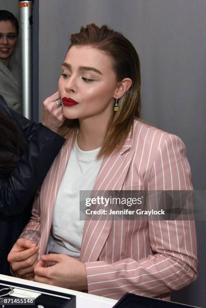 Chloe Grace Moretz tries on jewelry at the Forevermark Tribute event on November 7, 2017 in New York City.