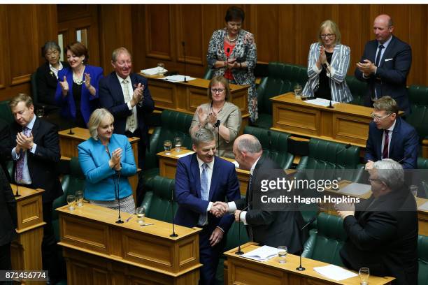National leader Bill English shakes hands with Steven Joyce after making a speech at Parliament on November 8, 2017 in Wellington, New Zealand....