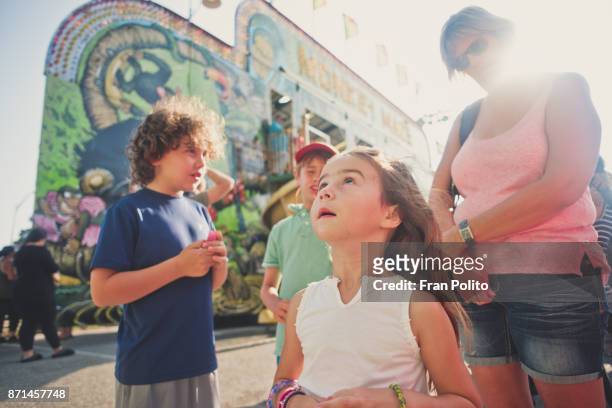 children at a carnival. - amusement park sky fotografías e imágenes de stock