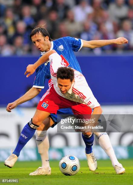 Albert Streit of Hamburg is challenged by Christoph Dabrowski of Bochum during the Bundesliga match between Hamburger SV and VfL Bochum at HSH...